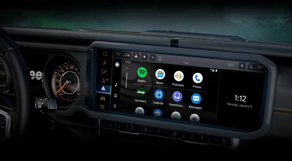 A close up shows the apps on the infotainment screen in a 2024 Jeep Wrangler.