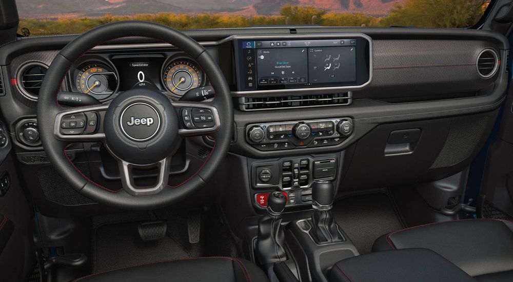 A close up shows the black interior and dash in a 2024 Jeep Gladiator.
